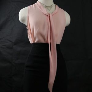 Formal pink blouse and black fitted skirt